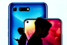 Huawei phone sales plunge, cutbacks planned as US pressure bites