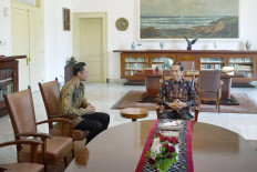 President Joko “Jokowi” Widodo (right) talks to the Democratic Party’s joint election command head Agus Harimurti Yudhoyono, the eldest son of former president Susilo Bambang Yudhoyono, at Bogor Palace recently. Representing the Democrats, which was part of the coalition that backed challengers Prabowo Subianto and Sandiaga Uno, Agus congratulated Jokowi on winning the 2019 presidential election.