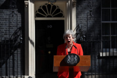 Choking back tears, Britain's May says goodbye to Downing Street