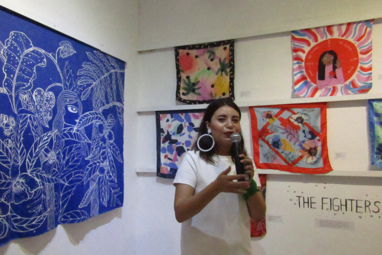 Valeriana Grajales, an artist and feminist activist from Colombia, discusses her artworks at the 'Girls Out Loud' exhibition at Grobak Art Kos at Hysteria art space in Semarang, Central Java, on Saturday, May 18.