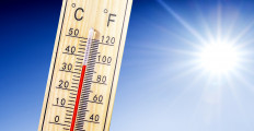 Thermometer in summer day shows or indicate high temperature degree with sun in background.
