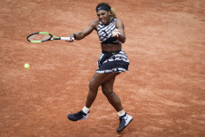 Serena Williams of the US plays a forehand return to Russia's Vitalia Diatchenko during their women's singles first round match on day two of The Roland Garros 2019 French Open tennis tournament in Paris on May 27, 2019.A maximum of only 1,000 spectators will be allowed each day at Roland Garros after the French government insisted Thursday on tougher restrictions to counter the resurgence of the coronavirus.