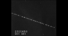 In this screengrab taken from a video shot by Marco Langbroek, a group of SpaceX Starlink satellites pass over Leiden, Netherlands on May 24, 2019. 
