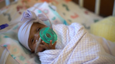 In this picture received by AFP from Sharp Mary Birch Hospital for Women & Newborns on May 29, 2019, shows baby Saybie, the world's smallest surviving newborn, when she weighed 3 lbs in March 2019 in San Diego, California. A baby girl who weighed 245 grams and measured 23 cm became the smallest baby in the world, a US hospital reported after being discharged five months after being in intensive care.