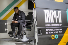 Mobile barber cuts a dash with Afro-Caribbean Londoners