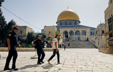 Israeli security forces intercept a young Jewish settler visiting the al-Aqsa Mosque compound, revered as the site of two ancient Jewish temples and home to al-Aqsa Mosque, Islam’s third holiest site, in the Old City of Jerusalem on Sunday, as Israelis mark Jerusalem Day.
