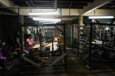 By a thread: Thai Muslim family keeps silk weaving heritage alive