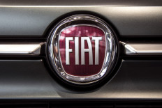 A picture taken on May 27, 2019 at a car dealer in Turin shows the logo of Italian carmaker Fiat, brand of Fiat Chrysler Automobiles (FCA) company. 