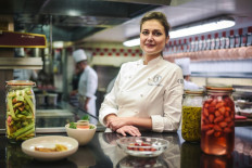 French pastry chief Jessica Prealpato of the Plaza Athenee hotel poses in her restaurant's kitchen for a portrait in Paris on June 6,