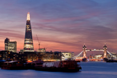 Sunset on the new London skyline with Tower Bridge and the new The Shard skyscraper