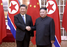 This screengrab taken of a video released by CCTV on June 20, 2019 shows Chinese President Xi Jinping (L) shaking hands with North Korean leader Kim Jong Un during their meeting in North Korea's capital Pyongyang. North Korean leader Kim Jong Un held talks with Chinese President Xi Jinping in Pyongyang on JUne 20 during a historic visit to burnish an uneasy alliance, with the two men each facing challenges of their own with US President Donald Trump.