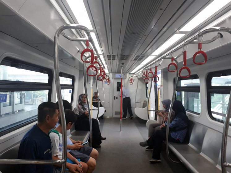 Residents ride on the LRT Jakarta during a public trial in Kelapa Gading in North Jakarta on Tuesday, June 11, 2019.