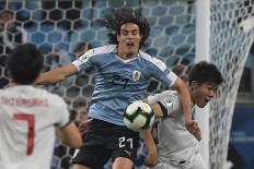 Japan, Uruguay draw after new VAR controversy
