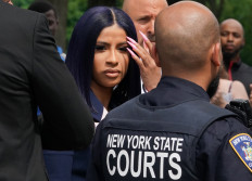Rapper Cardi B denies strip club brawl charges