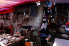 Traders at Sindang Market, Koja, North Jakarta,  on Wednesday. 