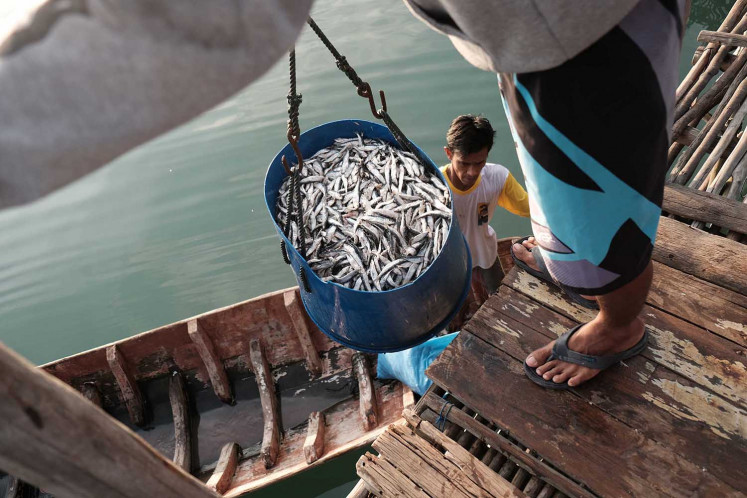 Fresh catch: Fishermen of Tanjung Binga village on Belitung Island cure their fish in salt to maintain freshness. JP/Donny Fernando