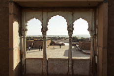 A group of tourists explores Kuldhara, an abandoned village built in the 13th century. JP/Irene Barlian