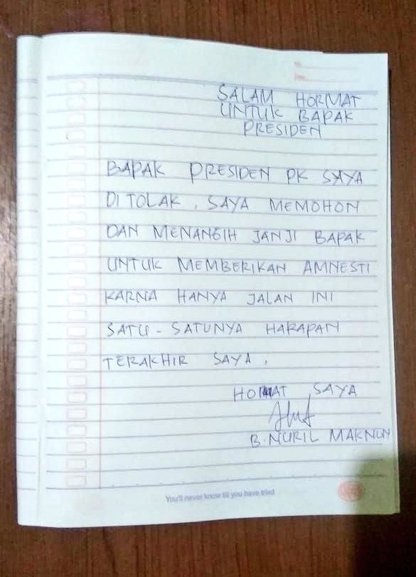Plaintive: Former teacher Baiq Nuril writes in a school copy book a plea for President Joko 