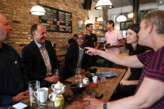 Customers enjoy drinks at the Green Vic pub, which is aiming to be the world's most ethical pub, poses for a photograph in Shoreditch, London, Britain, on July 5, 2019. 