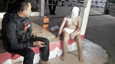 Depok Police scold boy pretending to be 'tuyul' for YouTube