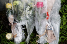 Animation fans lay flowers, pay respects at Japan studio ravaged by arson