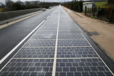 This file photo taken on December 22, 2016 shows a solar panel road pictured following its inauguration in Tourouvre, Normandy, northwestern France. 