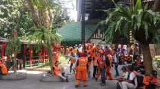 Orange troops, keeping city clean while people keep littering