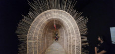 A walk through time: A visitor walks through a tunnel-shaped bamboo art installation titled 'Bubu Waktu' (Time Trap) by Sunaryo at ARTJOG, which is held annually at the Jogja National Museum in Yogyakarta.