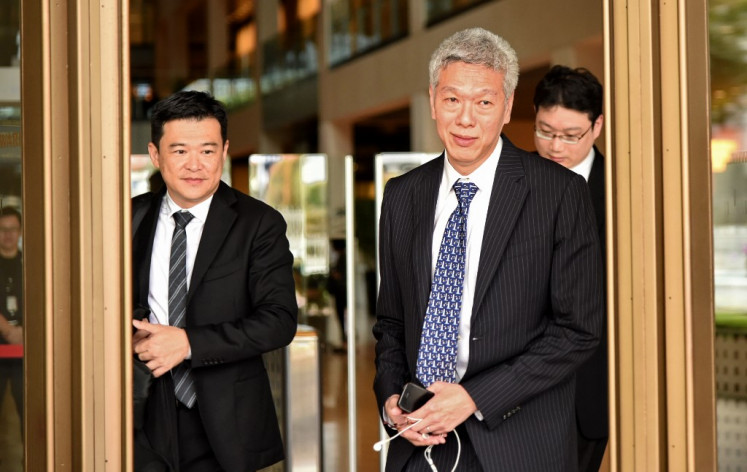Lee Hsien Yang, younger brother of Singapore's prime minister Lee Hsien Loong, leaves the Supreme court on April 10, 2017. Lee Hsien Yang and Lee Wei Ling, the younger siblings of Singapore’s current prime minister Lee Hsien Loong, have taken the government to court for control over oral history tapes recorded by their father.
