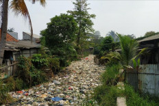 Residents of Bahagia subdistrict not happy about waste-covered river in Bekasi 