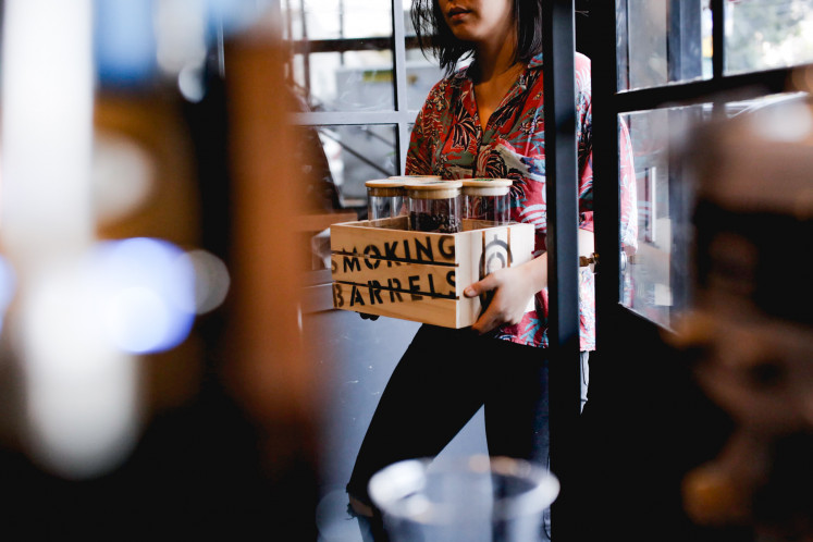 On the go: Smoking Barrels Craft Coffee buys coffees directly from farmers and gets them informally scored during cupping sessions at ABCD School of Coffee in Menteng, Central Jakarta.  