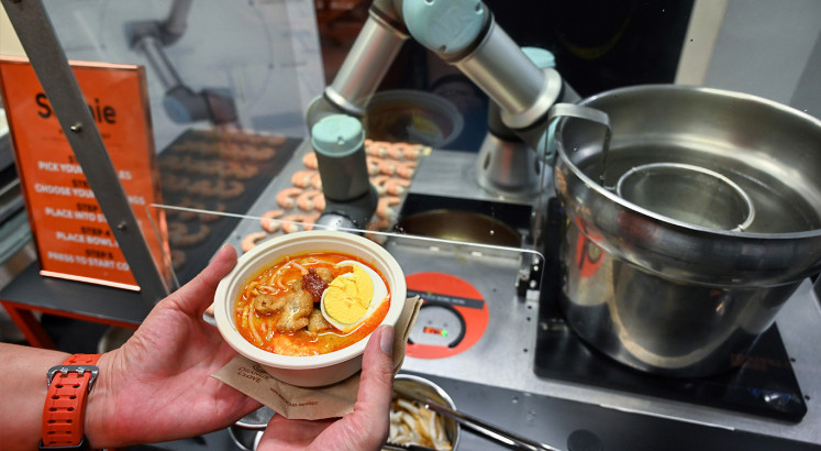 Sophie the robot whips up oodles of Singapore noodles