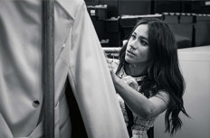This undated handout photo issued on July 28, 2019 by Kensington Palace shows Britain's Meghan, Duchess of Sussex, Patron of Smart Works, in the workroom of the Smart Works London office. 
