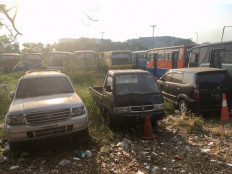 Vacant land graveyard for old, rusty vehicles in Greater Jakarta