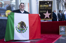 Del Toro gets Hollywood star, urges immigrants to reject fear