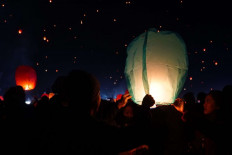 Visitors release lanterns at the 2019 Dieng Culture Festival in Dieng, Central Java, on Aug. 3.