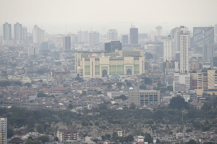 Smog covers Jakarta skyline as seen from above in this photo taken on Aug. 9, 2019. 