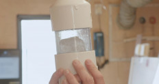 A sample taken from an ice core is inspected by a scientist from the US-led Northwest Passage Project during an 18-day icebreaker expedition that took place in July and August 2019, in a still image taken from a handout video obtained by REUTERS on August 14, 2019. 