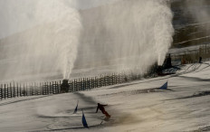 Snow cannons spray artifical snow on a ski slope at El Colorado skiing centre, in the Andes Mountains, some 30 km from Santiago on August 8, 2019. 