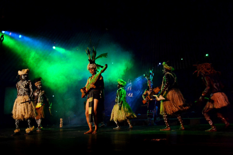 Papuan music fuses with Kalimantan music in a performance at the Central Java Cultural Park.