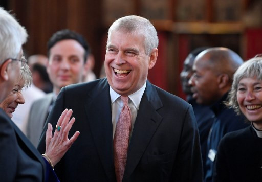 Britain's Prince Andrew, Duke of York shares a joke with guests as he visits The Honourable Society of Lincoln&rsquo;s Inn to open the new Ashworth Centre, and re-open the recently renovated Great Hall, in London on December 13, 2018. 
