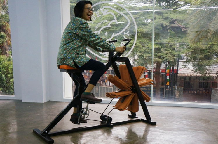 Curator Grace Samboh tests equipment at Super Baday Fitness Center.