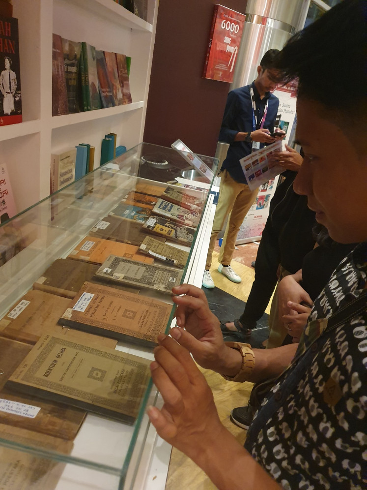 Mandatory reading material: A visitor looks at the original copies of Balai Pustaka's canons. Some of the books are still reprinted and used in schools.