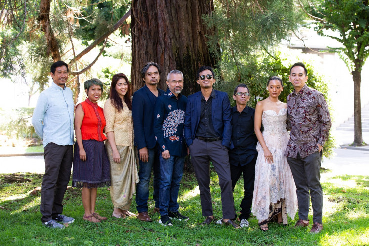 All smiles: Indonesian director Yosep Anggi Noen poses with the producers and cast of 'The Science of Fictions'.