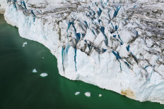 High above Greenland glaciers, NASA looks into melting ocean ice