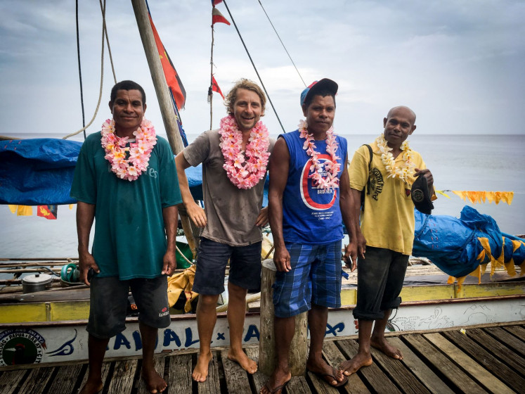 All smiles: The proud crew of the 'Tawali Pasana' – (from left) Sanakoli John, Thor F. Jensen, Justin John and Job Siyae – poses upon completing the circumnavigation of New Guinea.