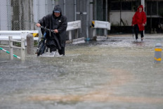 Two dead as Japan orders 670,000 to flee heavy rains