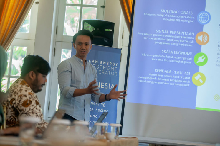 Clean energy vision: WRI Indonesia climate and energy manager Almo Pradana (right) makes a presentation about the World Resources Institute (WRI).