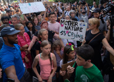 Greta Thunberg (second left in pink) joins a protest by climate activist near UN headquarters on August 30, 2019, in New York. 