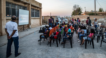 Mobile cinema brings movie magic to Syria Kurd children